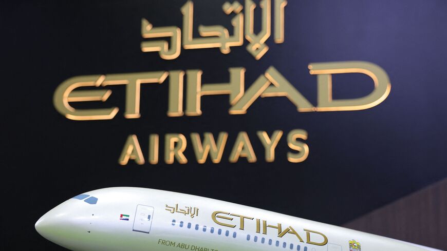 An Etihad airplane model is displayed at the Arabian Travel Market Exhibition.