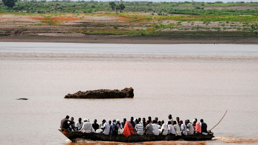 A boat sails along the Setit river bordering Ethiopia.