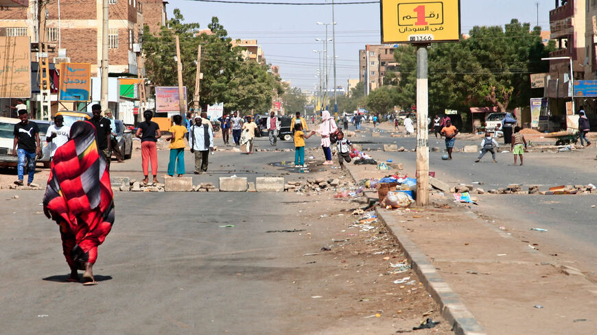 Sudanese demonstrators barricade Al-Sahafa street during ongoing protests against a military coup, Khartoum, Sudan, Jan. 18, 2022.