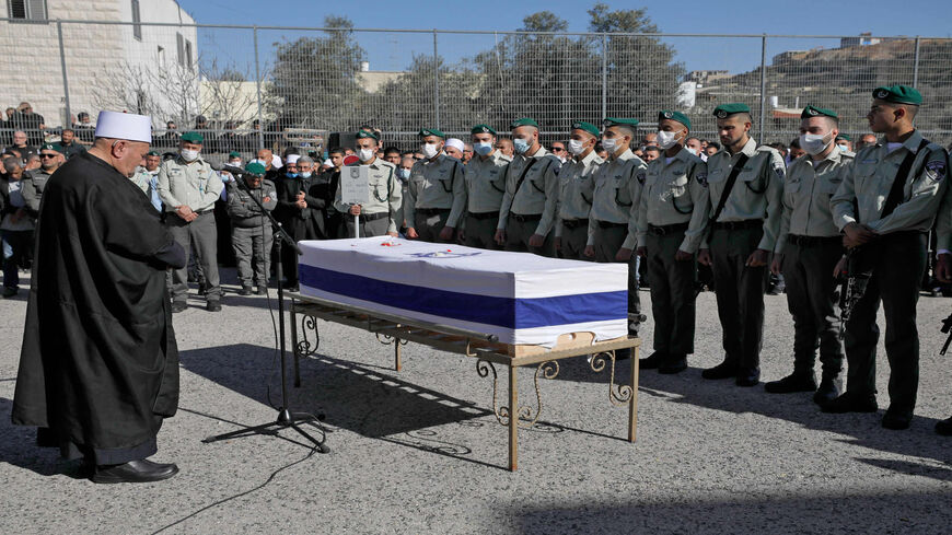 Israeli policemen and family members of Israeli border police officer Yezen Falah attend his funeral in the Druze village of Kisra-Sumei, northern Israel, March 28, 2022.