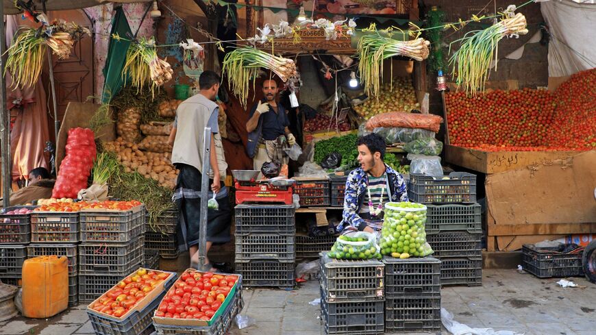 Yemenis shop at a market.