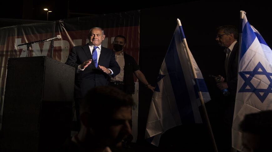 Former Israeli Prime Minister Benjamin Netanyahu leaves after speaking at a protest against the Israeli government, Jerusalem, April 6, 2022.