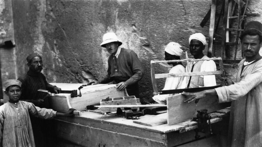 English Egyptologist Howard Carter (1874-1939) supervises carpenters preparing to reseal Tutankhamen's tomb, circa 1923.