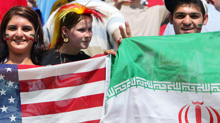 Fans wave US and Iranian flags during the World Cup 2006.