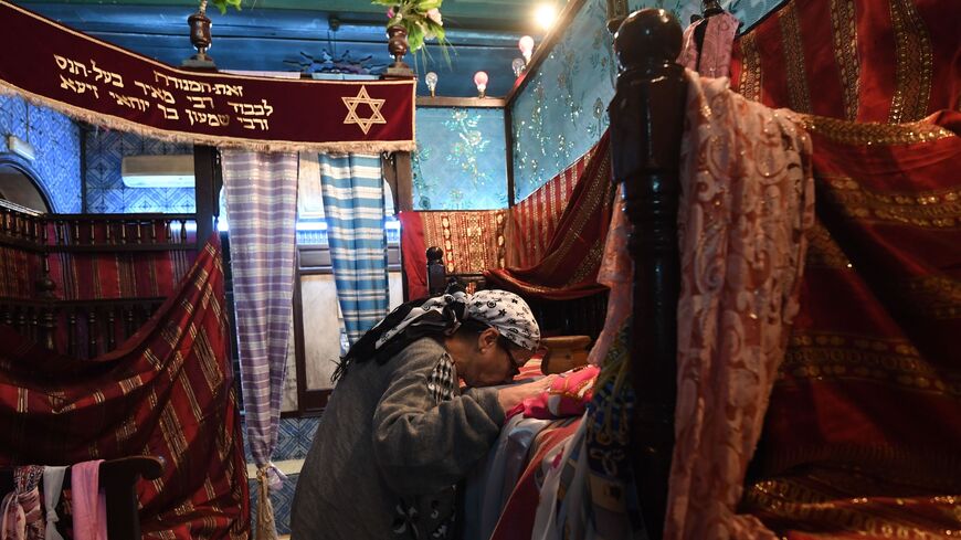 A Tunisian Jewish woman is seen in the Ghriba synagogue in the Tunisian resort island of Djerba.