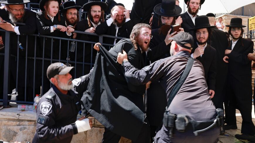 Ultra-Orthodox Jews trying to enter the grave site of Rabbi Shimon Bar Yochai scuffle with police in the northern Israeli village of Meron