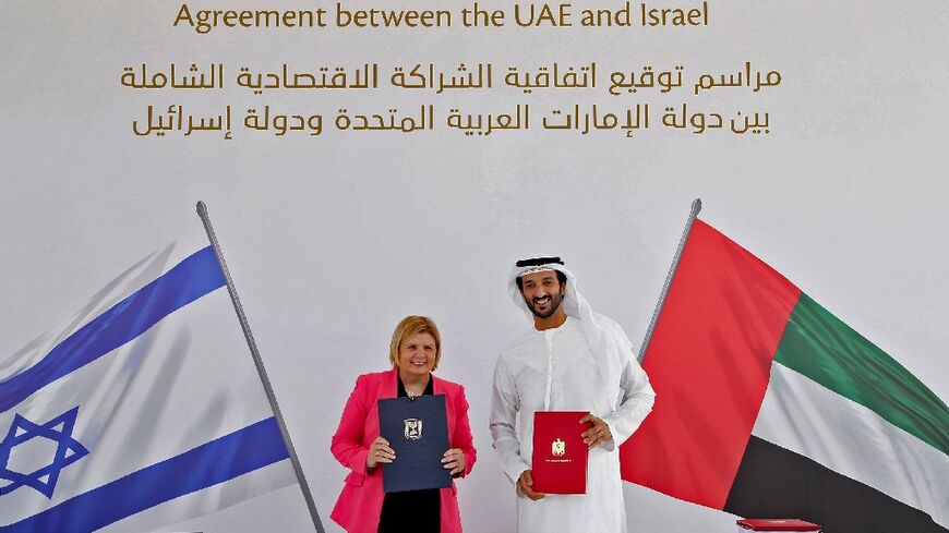 The economy ministers of Israel and the UAE, Orna Barbivai, on the left, and Abdulla bin Touq al-Marri, at the May 31, 2022 signing ceremony for a free trade deal in Dubai