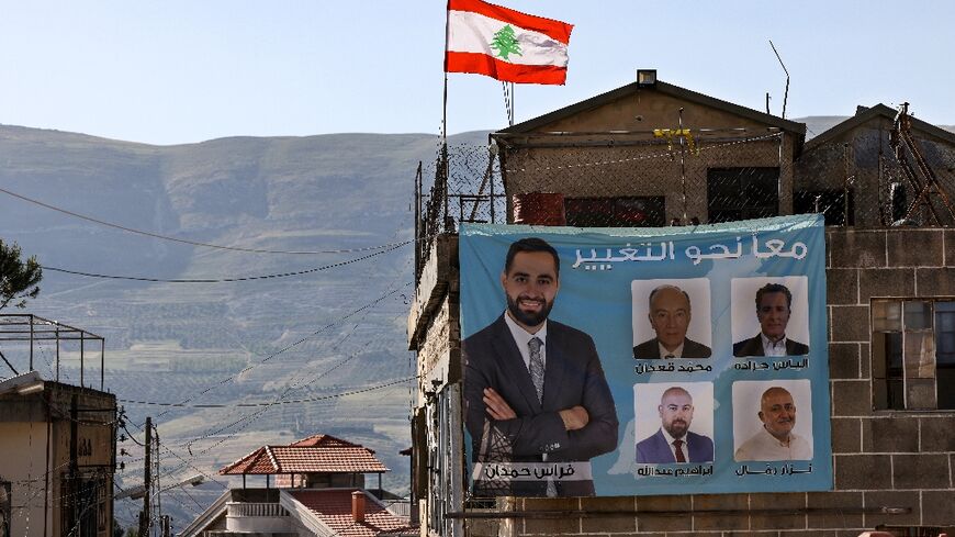 A banner bearing the image of newly elected Lebanese MP Firas Hamdan is seen in the southern Lebanese village of Kfeir