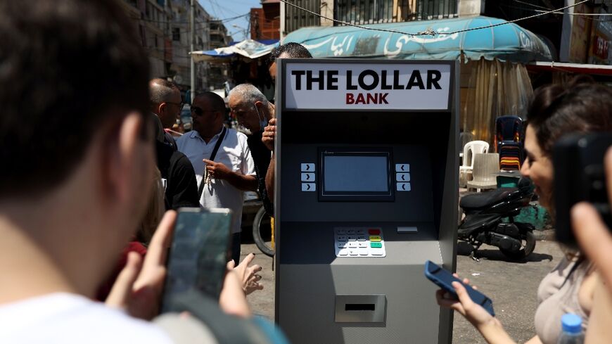 Lebanese surround a mock ATM, distributing fake banknotes called "lollars"