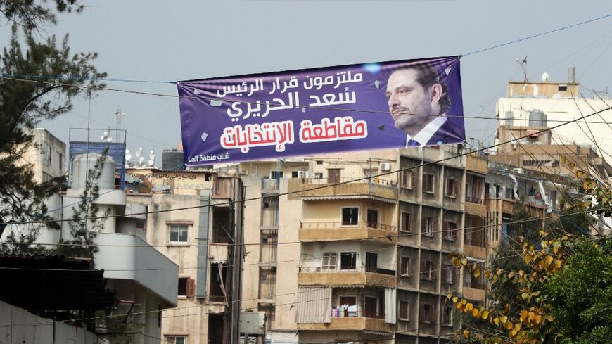 A banner bearing a picture of the Lebanese ex-prime minister reads: 'Committed to PM Saad Hariri's decision to boycott the elections'