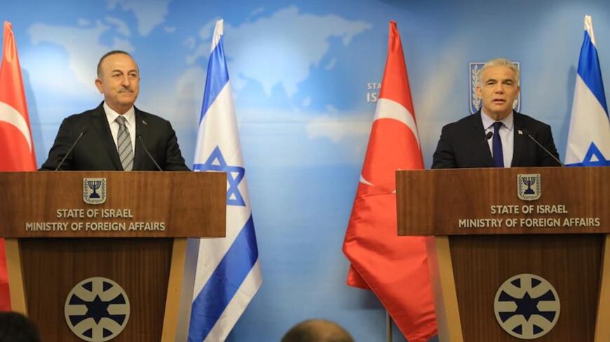 Israeli Foreign Minister Yair Lapid (R) in joint statements with Turkish Foreign Minister Mevlut Cavusoglu (L).