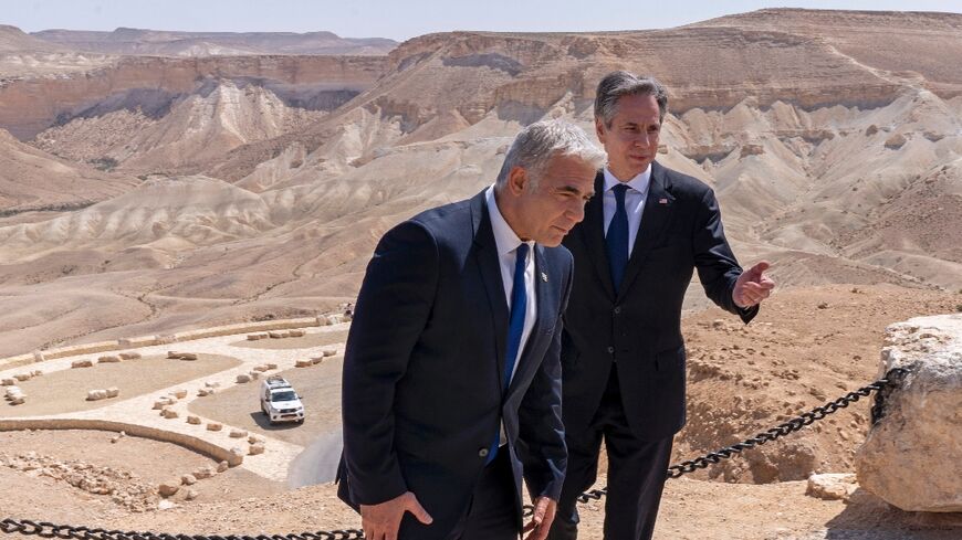 Israel's Foreign Minister Yair Lapid (left) and US Secretary of State Antony Blinken visit Ben-Gurion's Tomb National Park in March 2022 -- Lapid is set to become Israel's caretaker prime minister 