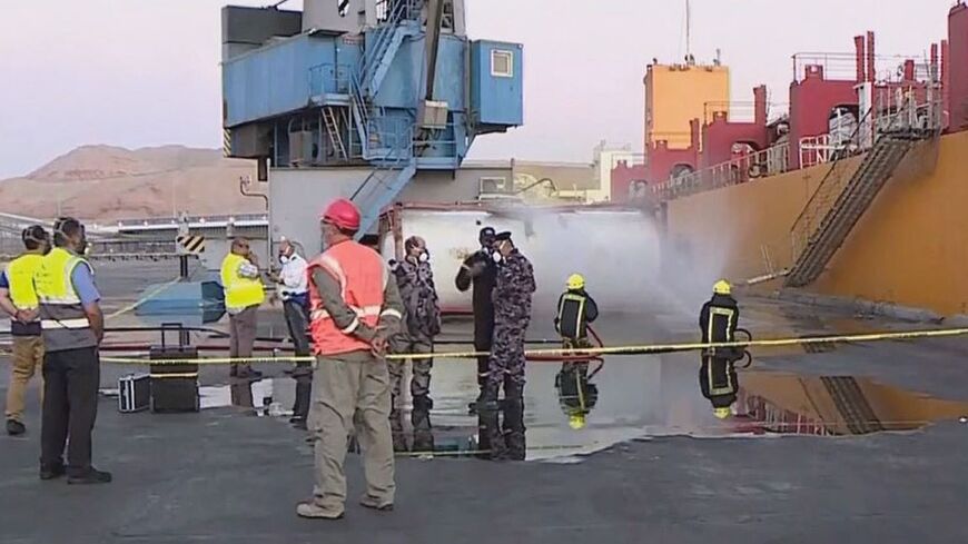 Footage on state TV showed a large cylinder plunging from a crane on a moored vessel in Jordan's Aqaba port, causing a violent explosion of yellow gas