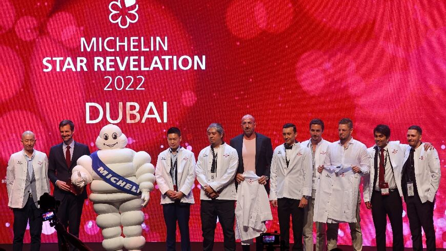 Chefs and owners pose for photographs as 11 Dubai restaurants are awarded the first Michelin stars in the Middle East
