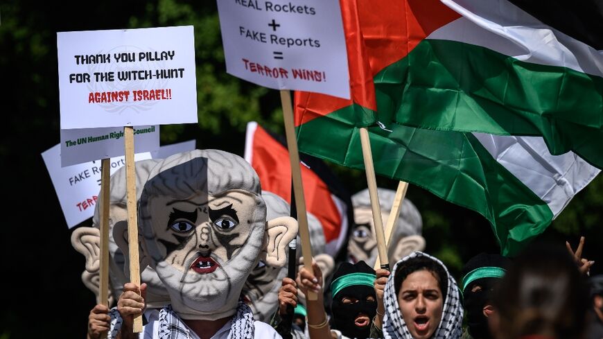 Dozens of Israeli reserve soldiers and students -- some of them dressed like Palestinian Hamas militants -- protested outside the UN headquarters in Geneva