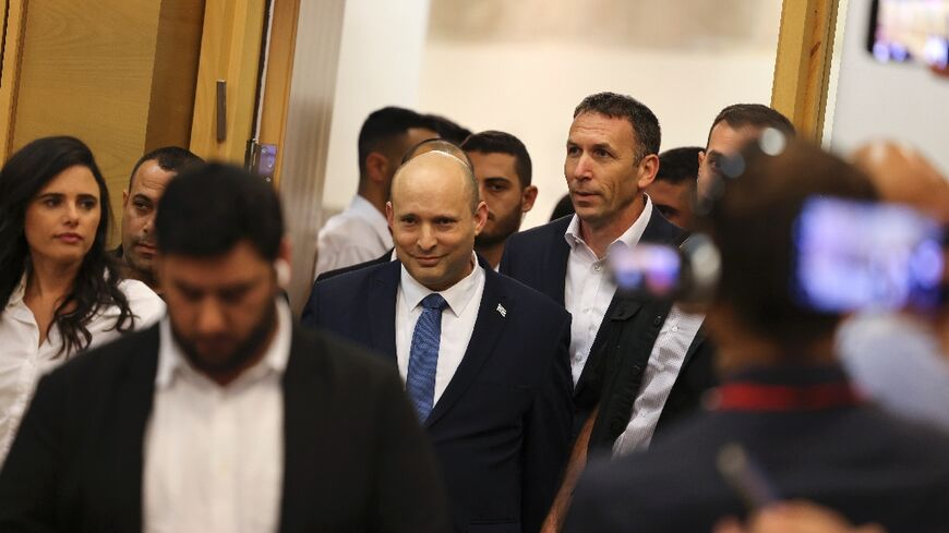 Israel's outgoing Prime Minister Naftali Bennett arrives to address lawmakers from his Yamina party at the Israeli parliament 