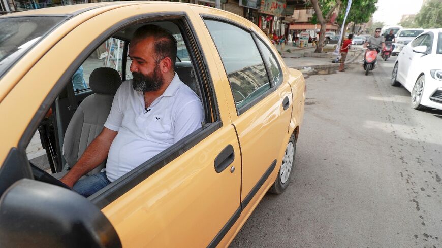 Iraqi taxi driver Osama Mohammed has seen his income shrink as congestion in the capital Baghdad has become worse
