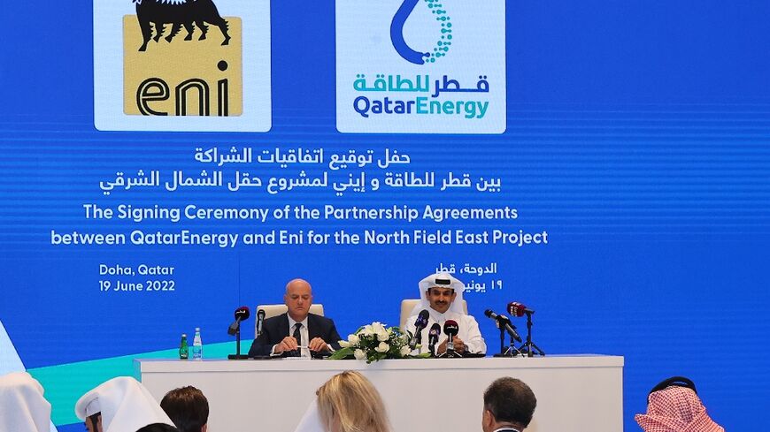 Qatar's Energy Minister and president and CEO of QatarEnergy Saad Sherida al-Kaabi (R) and Claudio Descalzi, CEO of Italian multinational oil and gas company ENI, attend the signing ceremony for their joint venture
