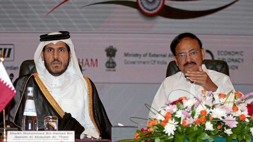 India's Vice-President Venkaiah Naidu (R) took part in a business forum in Doha on Sunday with Qatar's Minister of Commerce and Industry Mohammed Bin Hamad Bin Qassim al-Abdullah al-Thani (L)