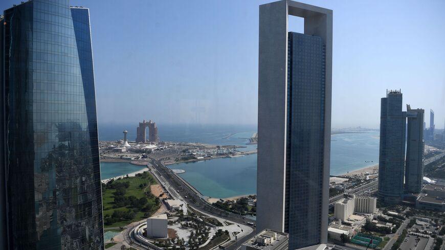 A general view taken on May 29, 2019, shows the seafront promenade in the Emirati capital, Abu Dhabi, with the Abu Dhabi National Oil Company headquarters (C). 
