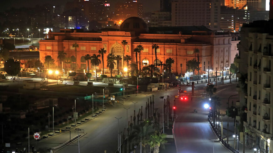 The street in Tahrir Square leading to the Museum of Egyptian Antiquities (in background) is deserted on the first day of a two-week night-time curfew imposed by the authorities to contain the spread of the novel coronavirus, Cairo, Egypt, March 25, 2020.
