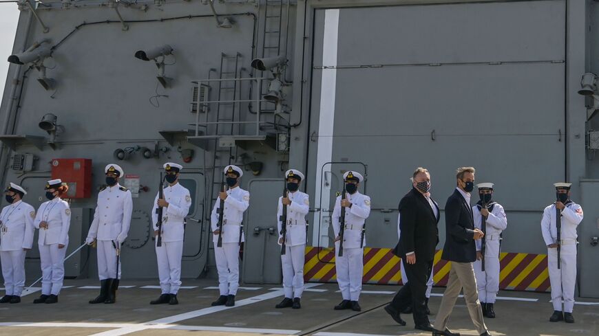 US Secretary of State Mike Pompeo (C-L) and Greek Prime Minister Kyriakos Mitsotakis visit the Greek Naval frigate Salamis.
