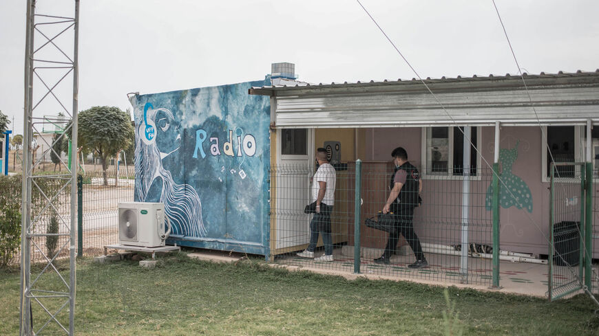 Journalists at Gardenya FM radio return after a report to the station's studio in Arbat refugee camp, east of Sulaimaniyah, Iraqi Kurdistan, Nov. 3, 2020.