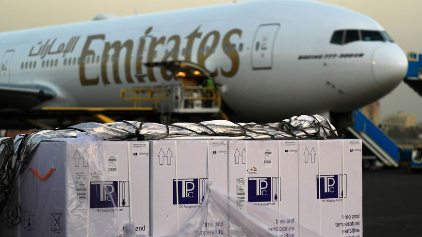 Boxes of coronavirus vaccines are stacked on the tarmac after the first batch arrived at Khartoum airport on an Emirates Airlines flight, Khartoum, Sudan, March 3, 2121.