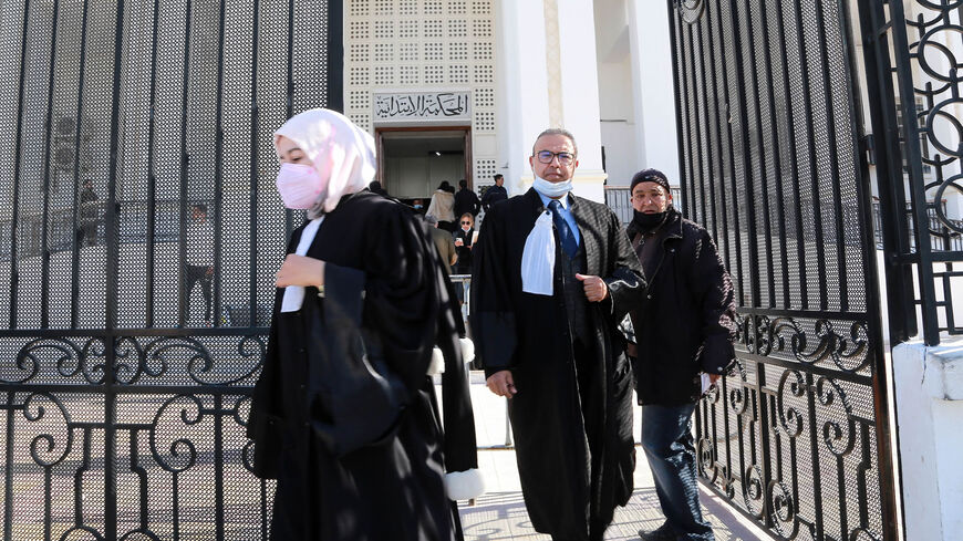 Tunisian citizens and lawyers leave the court of the governorate of Ariana after the announcement of a strike by judges, following the dissolution of the Supreme Council of the Judiciary by President Kais Saied, Feb. 9, 2022.