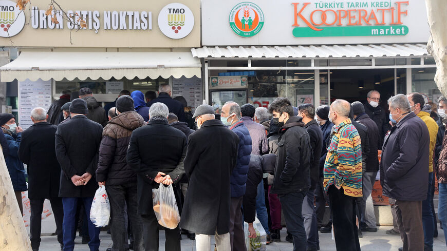 People queue to buy olive oil, which is sold cheaply by the Agricultural Products Office, Ankara, Turkey, Feb. 17, 2022.