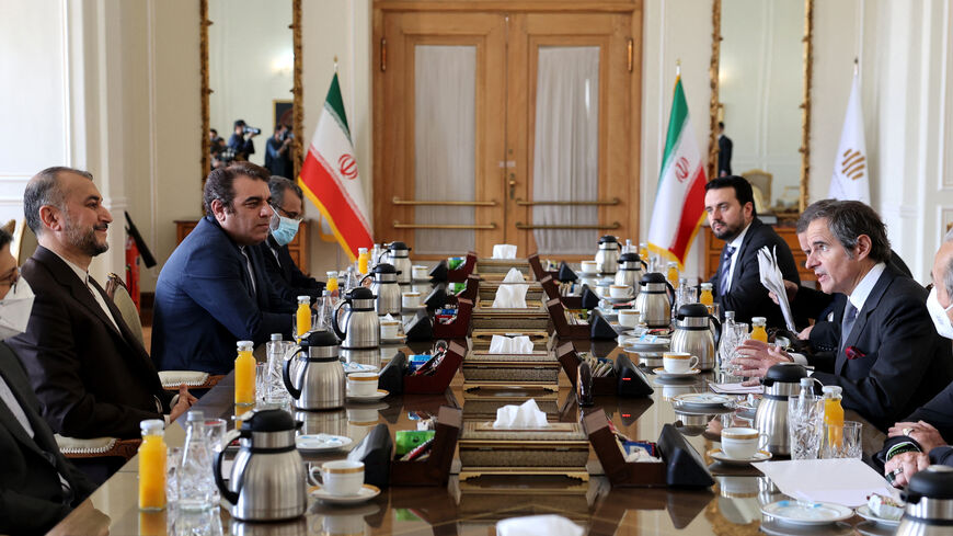 Iranian Foreign Minister Hossein Amir-Abdollahian (L) meets with head of the International Atomic Energy Agency (IAEA) Rafael Grossi (R) in Tehran on March 5, 2022.