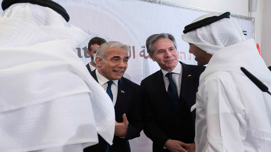 Israel's Foreign Minister Yair Lapid (2nd L) and US Secretary of State Antony Blinken (2nd R) chat with Bahrain's Foreign Minister Abdullatif bin Rashid al-Zayani (R) and Emirati Foreign Minister Sheikh Abdullah bin Zayed Al Nahyan (L), in Sde Boker, Israel, March 28, 2022.