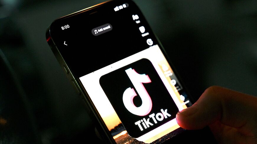 In this photo illustration taken on April 21, 2022, the icon of a video-sharing mobile phone application TikTok is pictured on a mobile phone.