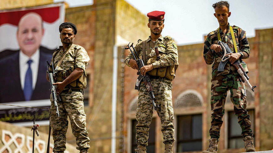 Soldiers loyal to the Aden-based Yemeni government stand guard.