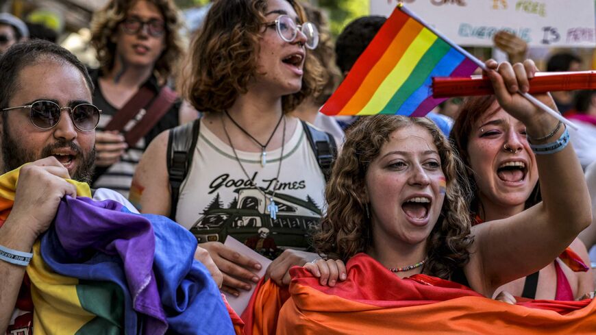 Participants chant slogans as they march during the annual Jerusalem Pride Parade.