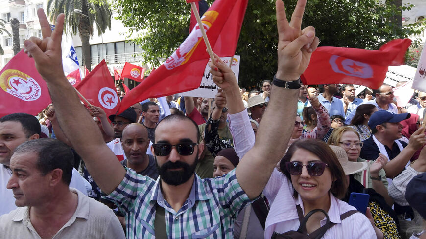 Supporters of the Tunisian General Labour Union gather with national flags during a rally outside its headquarters, amid a general strike announced by the UGTT, Tunis, Tunisia, June 16, 2022.