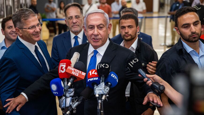 Israel's former premier Benjamin Netanyahu speaks to the press at the Knesset in Jerusalem on June 20, 2022. 