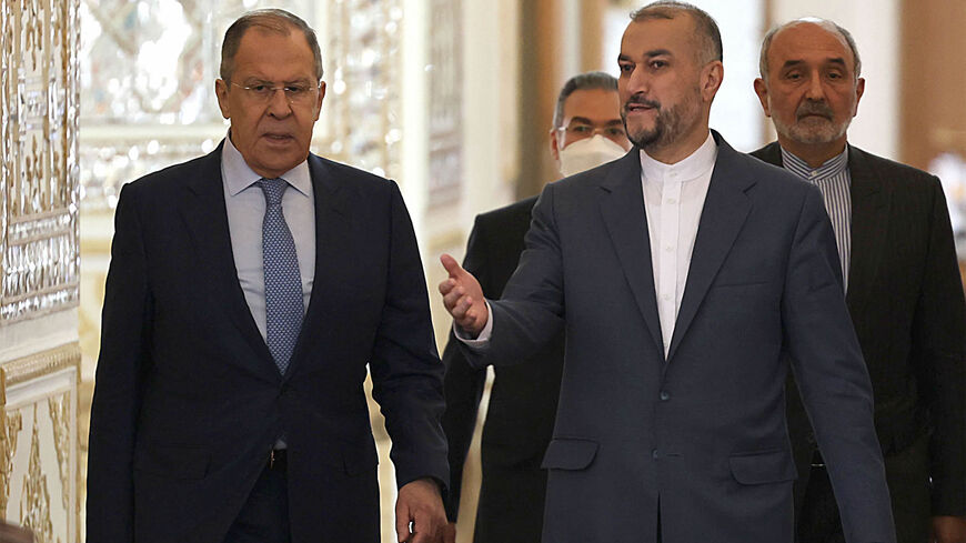 Iran's Foreign Minister Hossein Amir-Abdollahian (R front) arrives for a joint press conference with his Russian counterpart Sergey Lavrov (L) at the Foreign Ministry headquarters, Tehran, Iran, June 23, 2022.