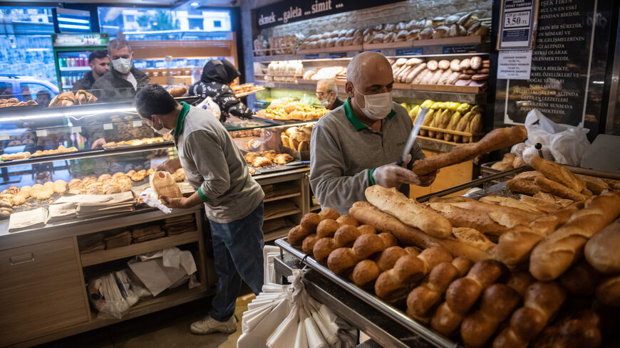 An employee packs bread at a bakery on March 23, 2022, in Istanbul, Turkey. 