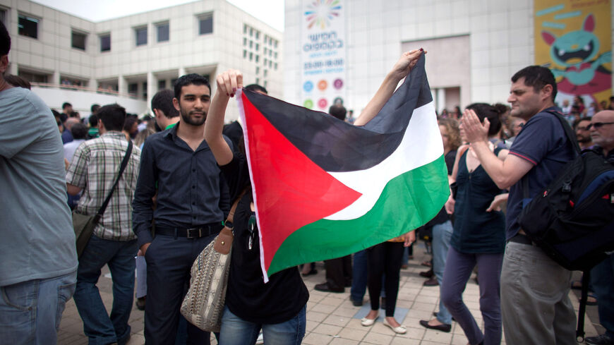 Left-wing Israeli and Palestinian students take part in a Nakba Day ceremony.