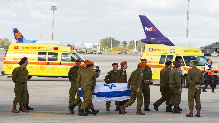 Soldiers carry the coffin of an Israeli who was killed in an Istanbul suicide bombing the previous day, upon its arrival at Ben Gurion Airport, Tel Aviv, March 20, 2016.