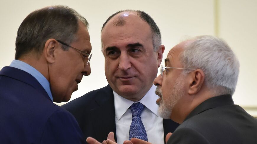 Russian Foreign Minister Sergey Lavrov (L) talks with his Azerbaijani counterpart Elmar Mammadyarov (C) and Iranian counterpart Mohammad Javad Zarif (R)in Baku on Aug. 8, 2016. 