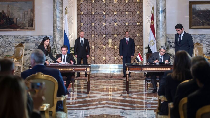 Egyptian President Abdel Fattah al-Sisi (back-R) and his Russian counterpart Vladimir Putin (back-L).