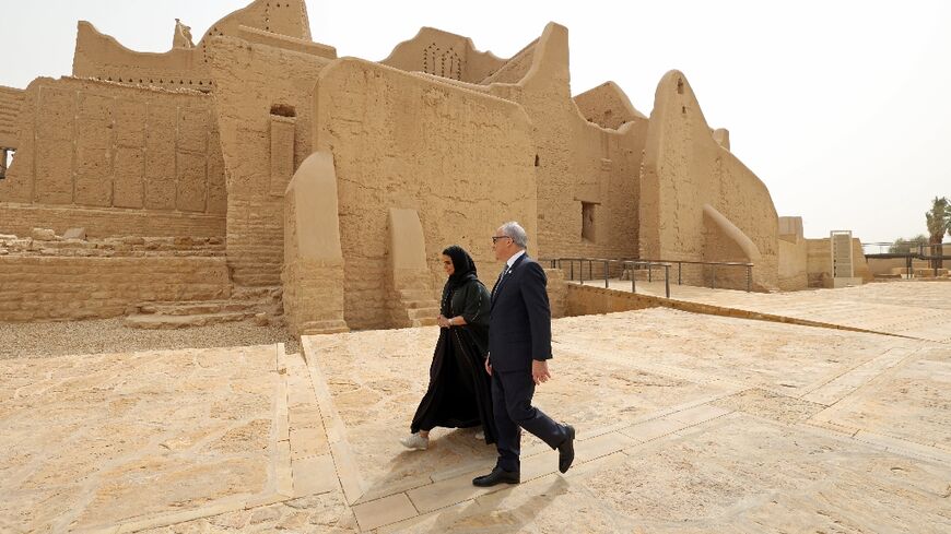 Saudi tour guide Nada Alfuraih walks in the historic district of Diriyah with Jerry Inzerillo, a Brooklyn entertainment executive who says heritage and entertainment are "highly compatible"