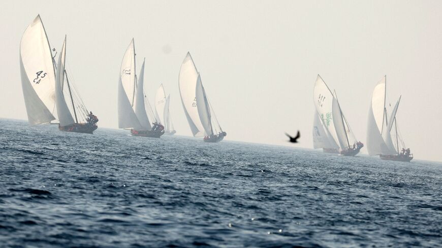Sailors take part in the al-Gaffal long-distance dhow race near Sir Bu Nair island in the UAE's waters