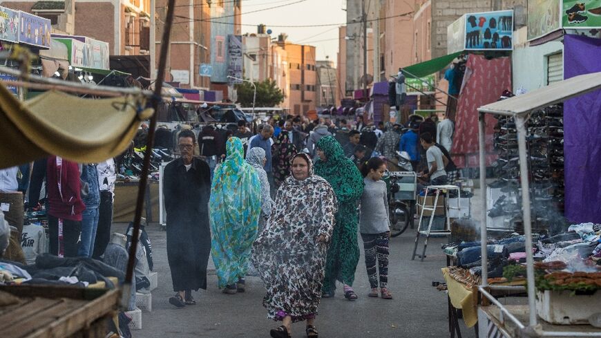 People walk along a market street in Western Sahara's main city of Laayoune in November 2018