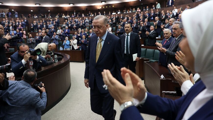 Turkish President Recep Tayyip Erdogan is applauded as he arrives to deliver a speech at the Turkish Grand National Assembly in Ankara on June 1 