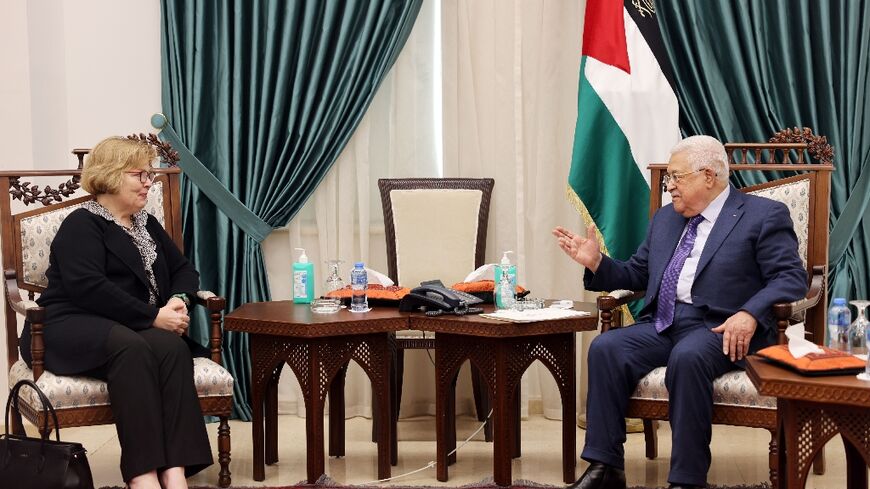 A handout picture from the Palestinian Authority's press office (PPO) on June 11, 2022, shows President Mahmud Abbas (R) meeting with Special Assistant to the US President Barbara Leaf at the presidency headquarters in the city of Ramallah