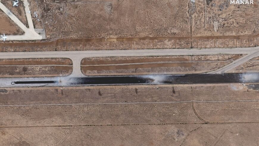 This satellite image released by Maxar Technologies shows damage to a runway at Damascus International Airport after an Israeli air strike