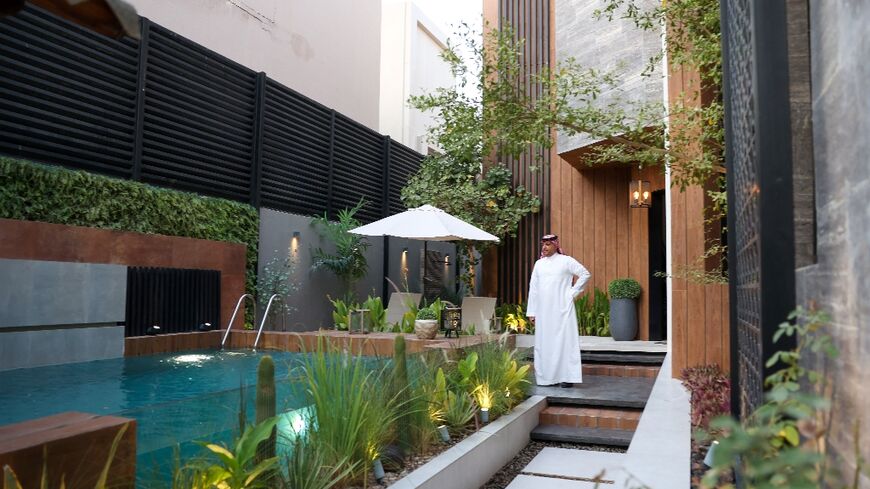 Haitham al-Madini stands next to the pool in his recently renovated villa in the Saudi capital, part of a wider shift towards a new form of architecture